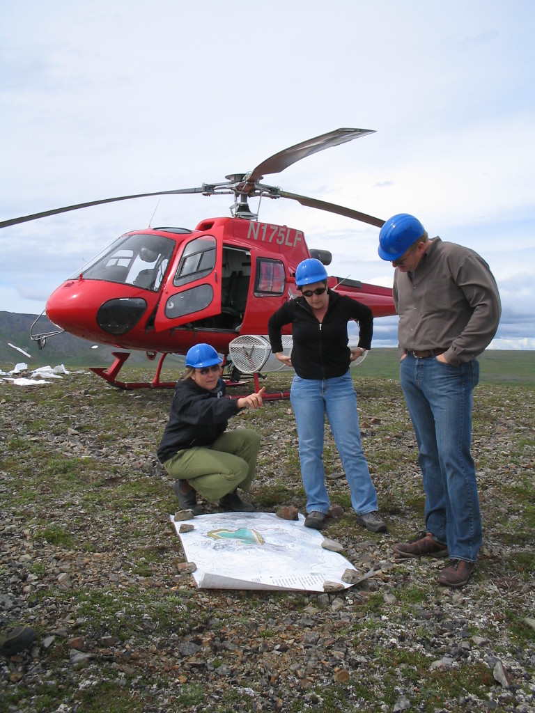 Catherine, Ella, and Ron discussing map of project area